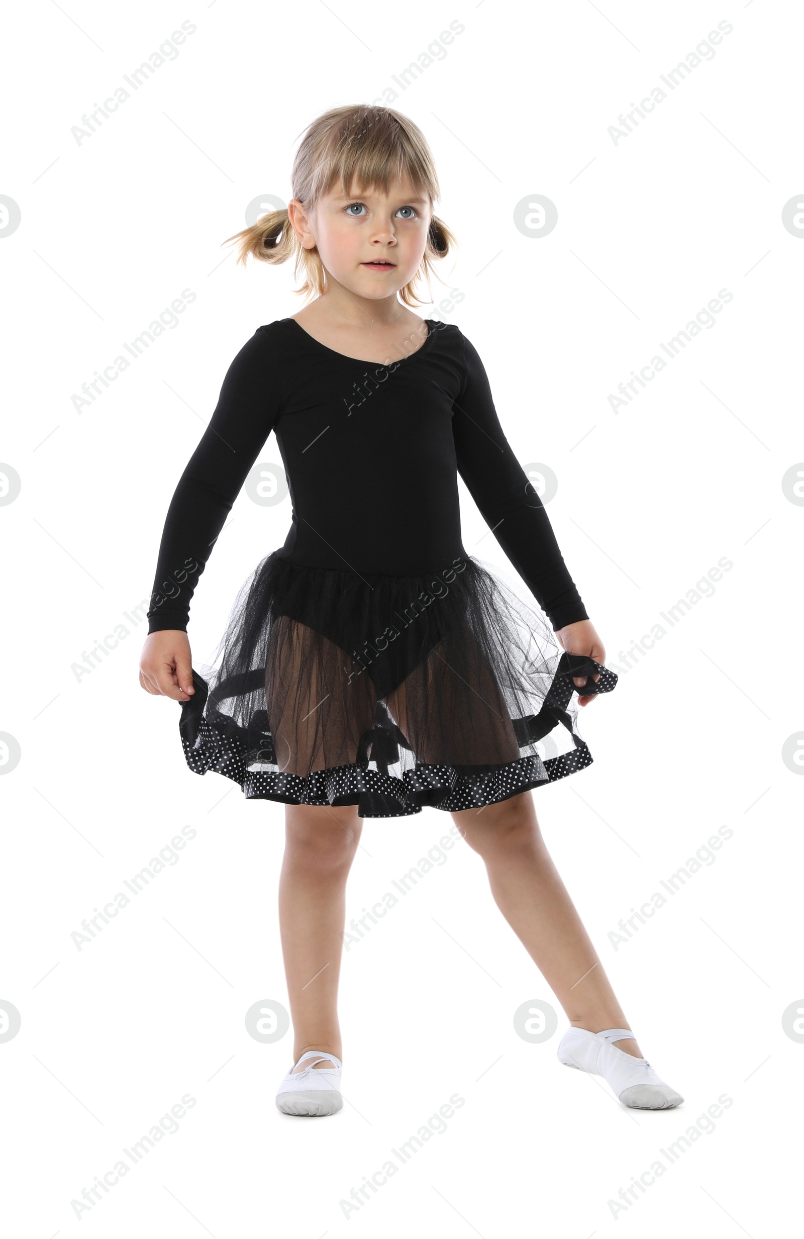 Cute little girl dancing on white background Photo of Cute little girl dancing on white background