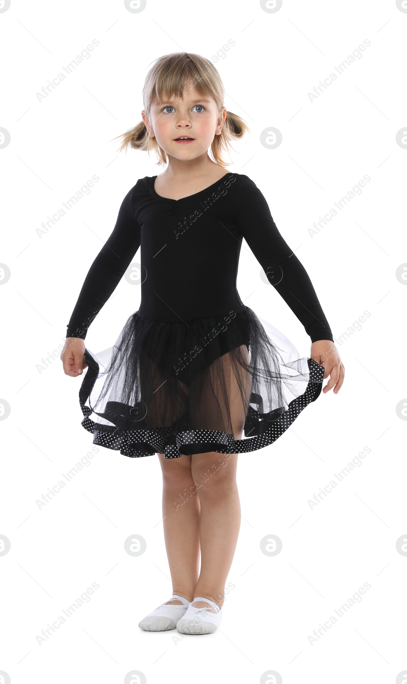 Cute little girl dancing on white background Photo of Cute little girl dancing on white background