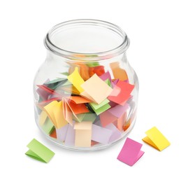 Photo of Colorful paper pieces in glass jar isolated on white
