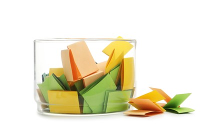 Photo of Colorful paper pieces in glass jar isolated on white