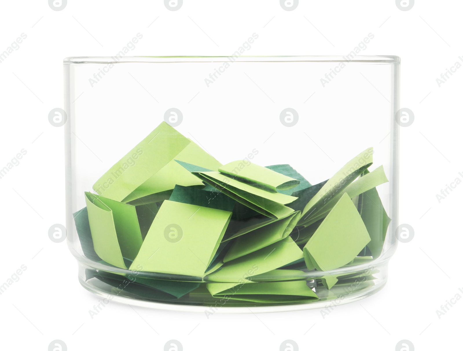 Photo of Colorful paper pieces in glass jar isolated on white