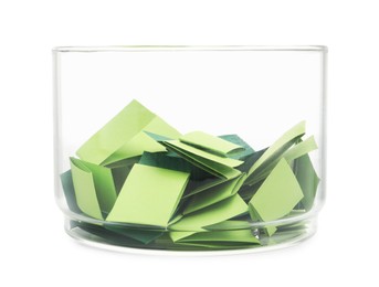 Photo of Colorful paper pieces in glass jar isolated on white