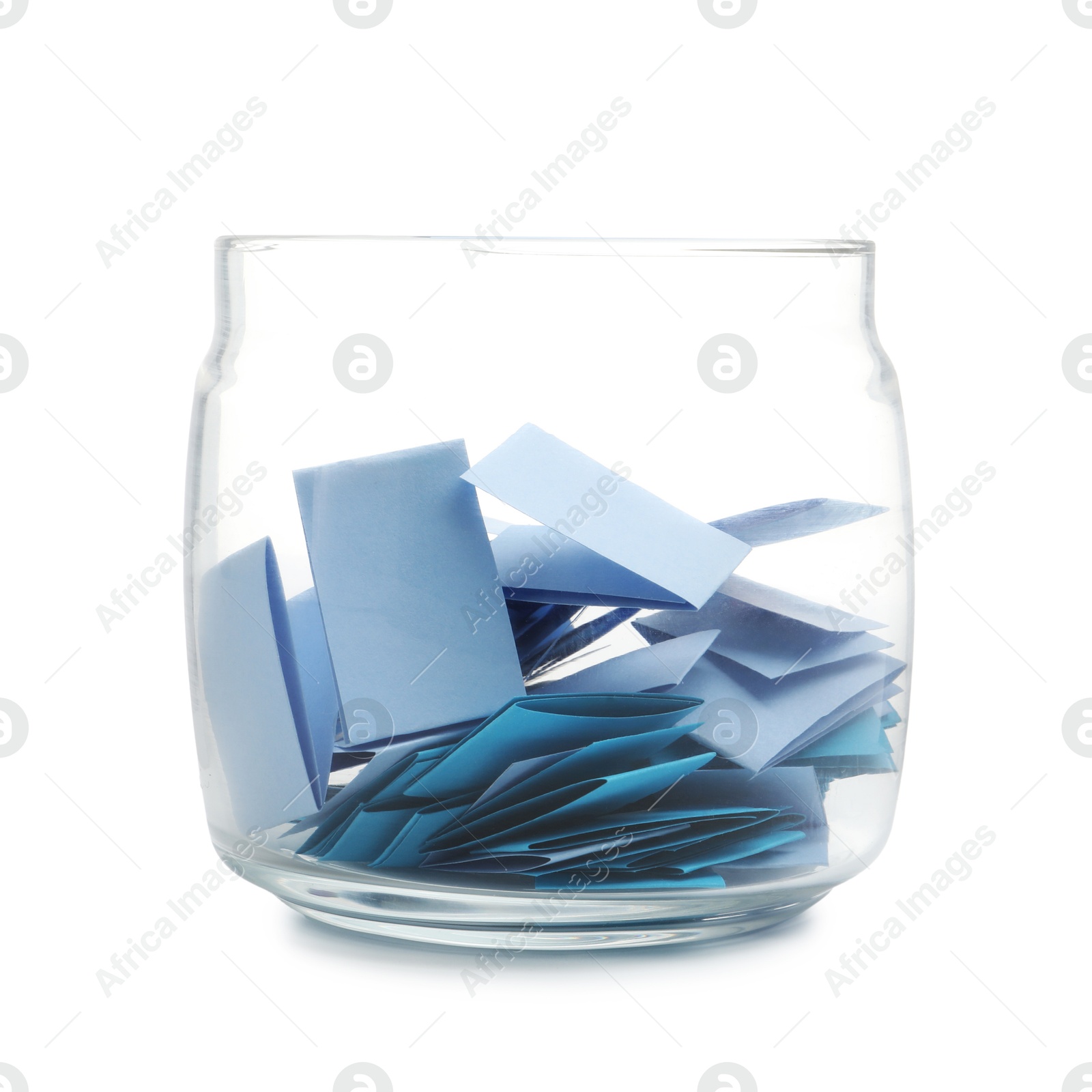 Colorful paper pieces in glass jar isolated on white Photo of Colorful paper pieces in glass jar isolated on white