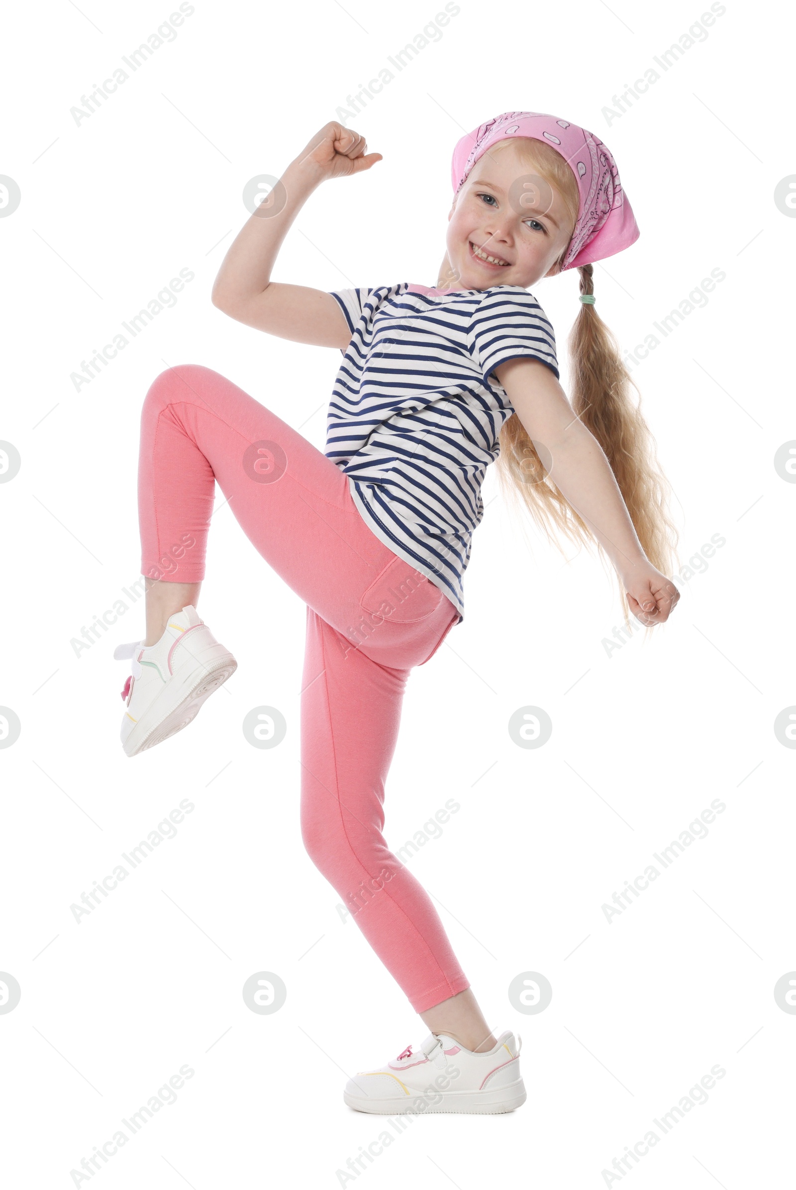 Cute little girl dancing on white background Photo of Cute little girl dancing on white background
