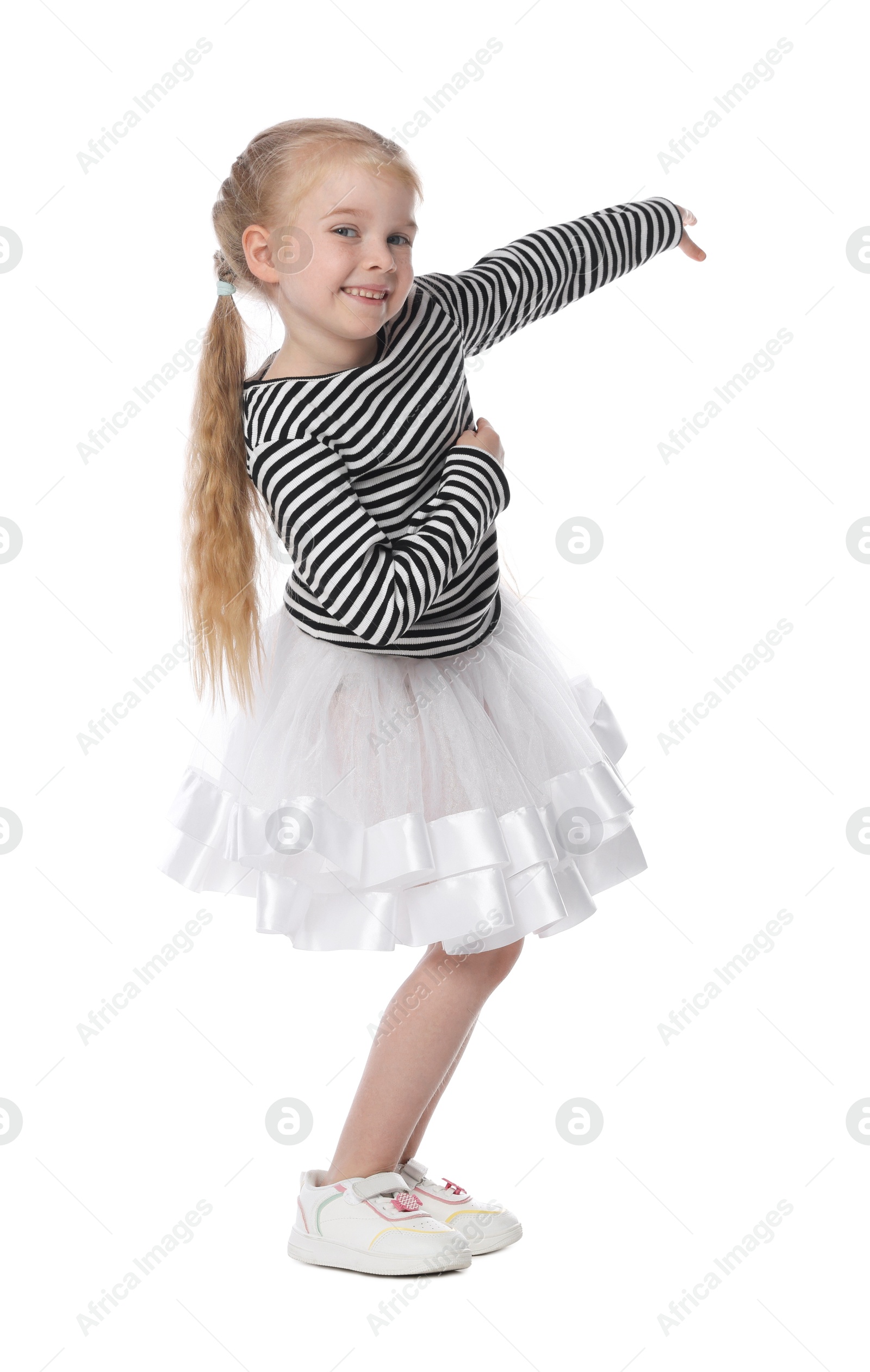 Photo of Cute little girl dancing on white background