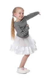 Photo of Cute little girl dancing on white background