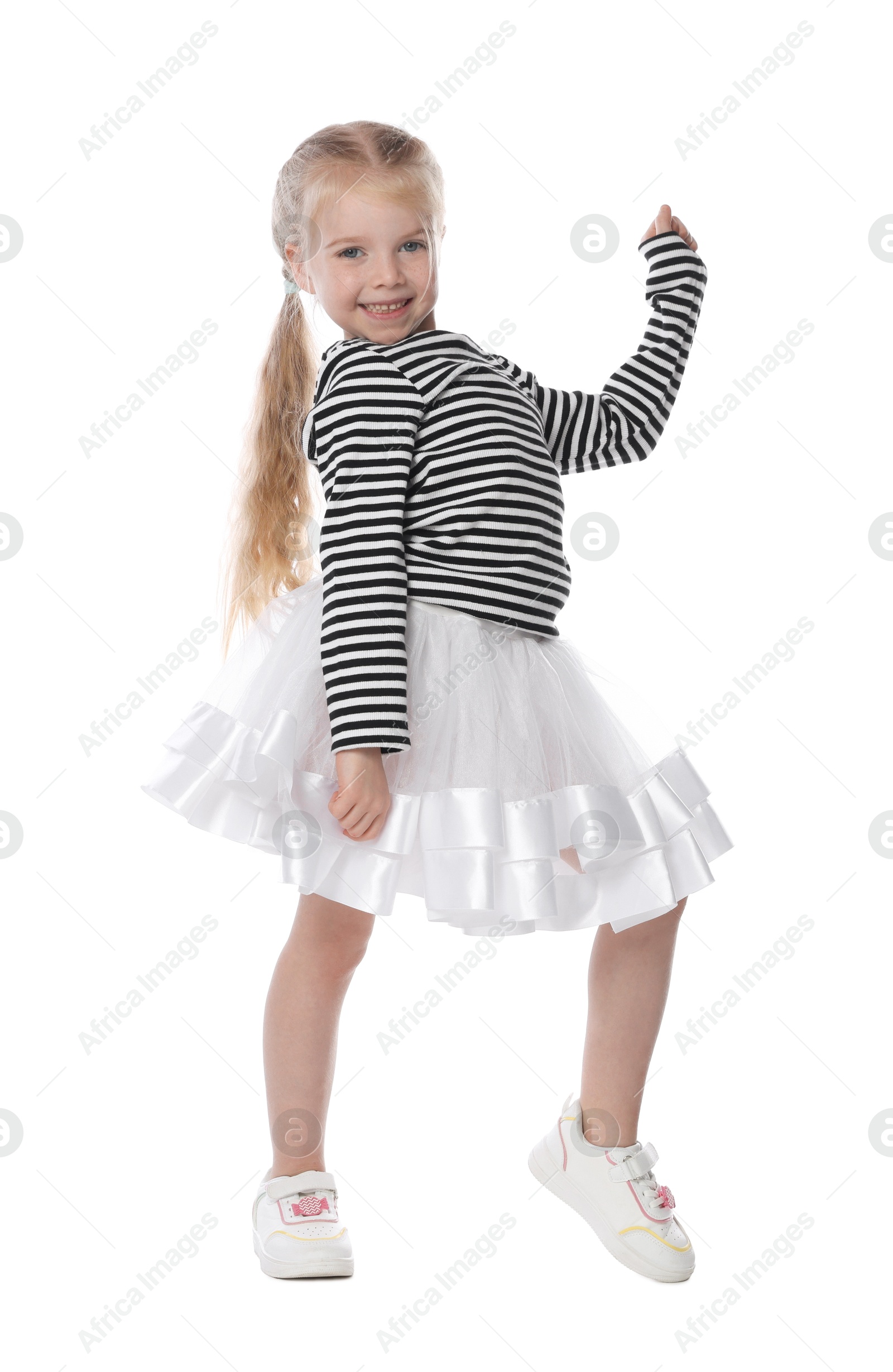 Cute little girl dancing on white background Photo of Cute little girl dancing on white background