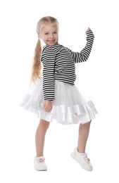 Photo of Cute little girl dancing on white background