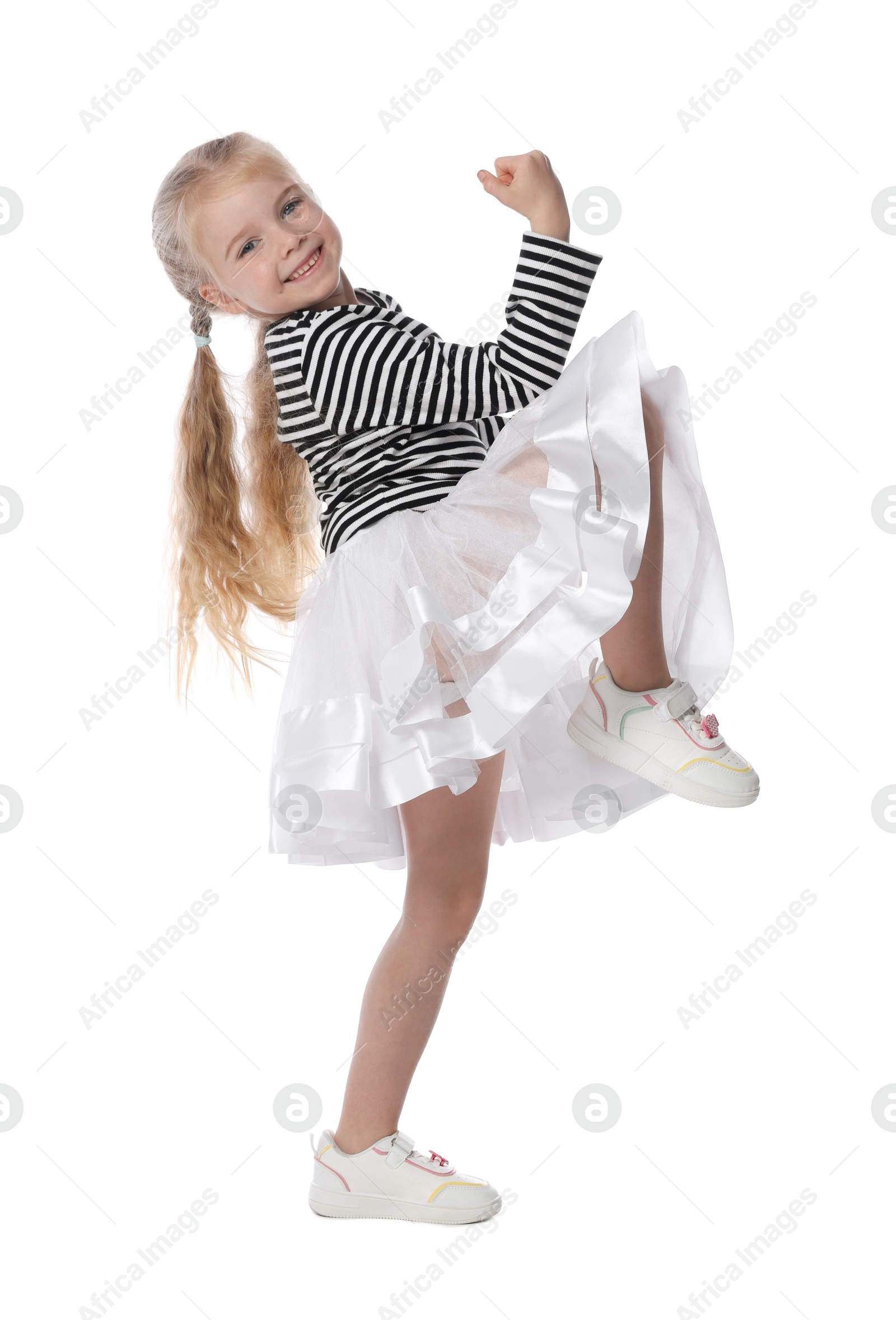 Cute little girl dancing on white background Photo of Cute little girl dancing on white background