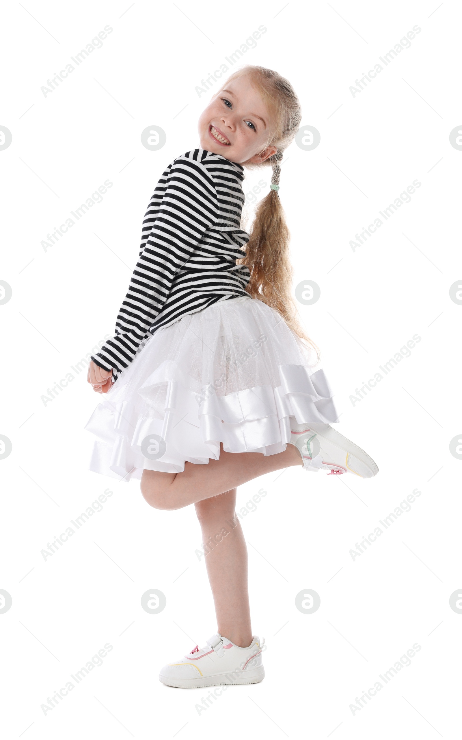 Cute little girl dancing on white background Photo of Cute little girl dancing on white background