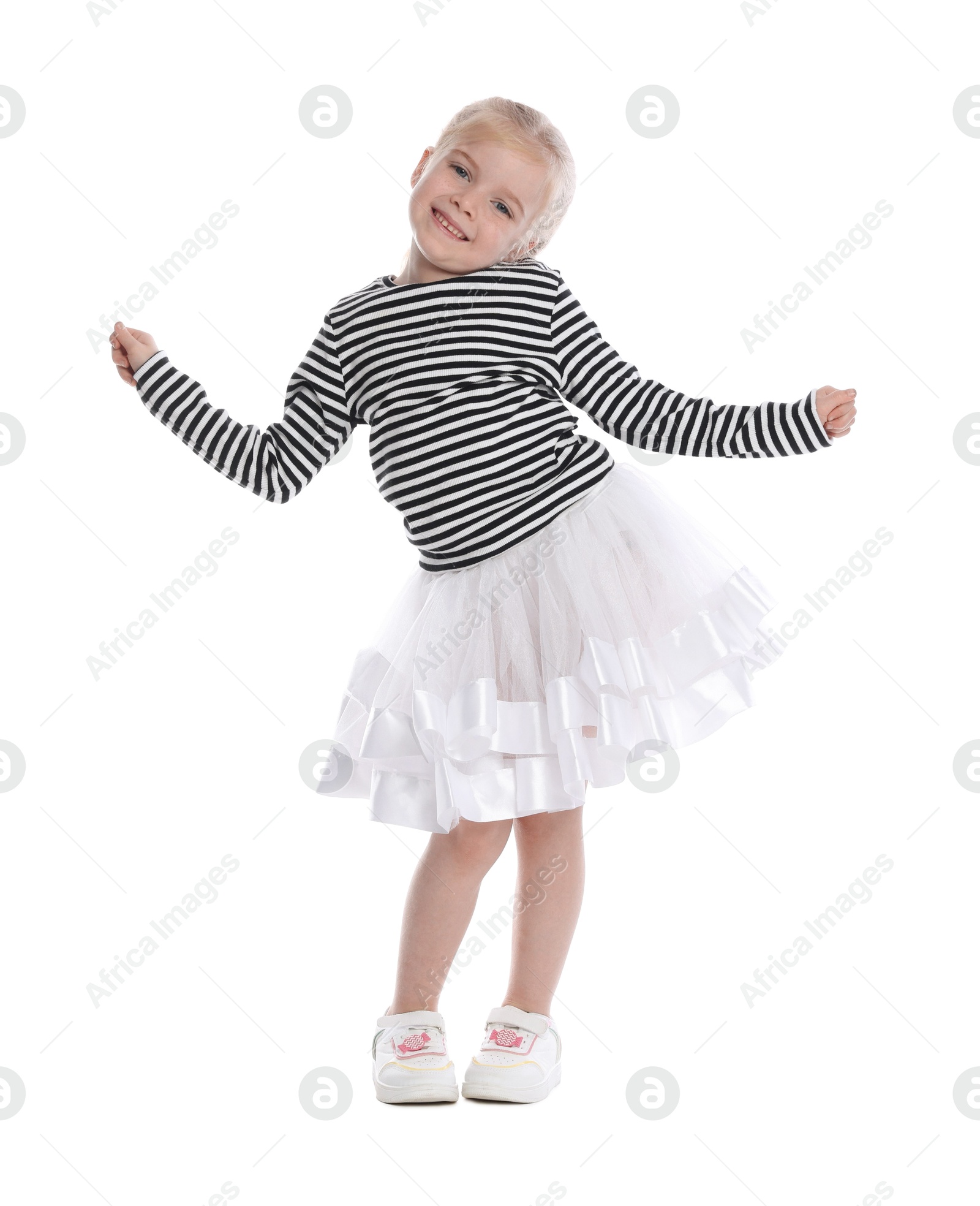 Cute little girl dancing on white background Photo of Cute little girl dancing on white background
