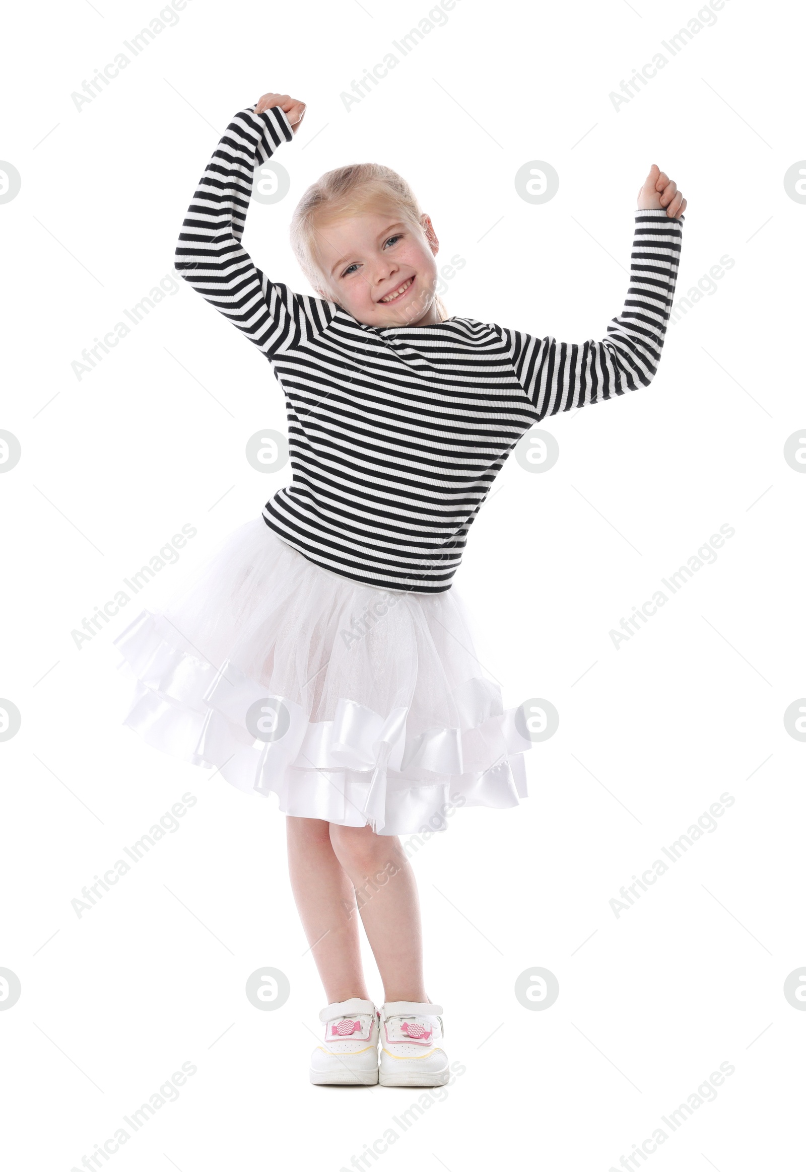 Cute little girl dancing on white background Photo of Cute little girl dancing on white background