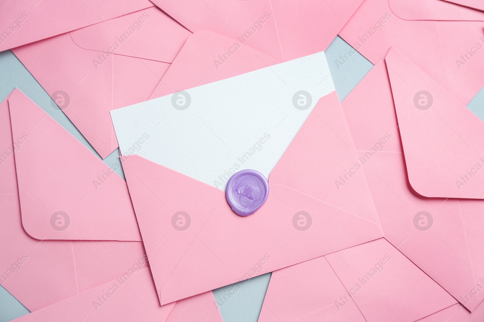 Blank invitation card and envelopes on grey background, flat lay. Space for design Photo of Blank invitation card and envelopes on grey background, flat lay. Space for design