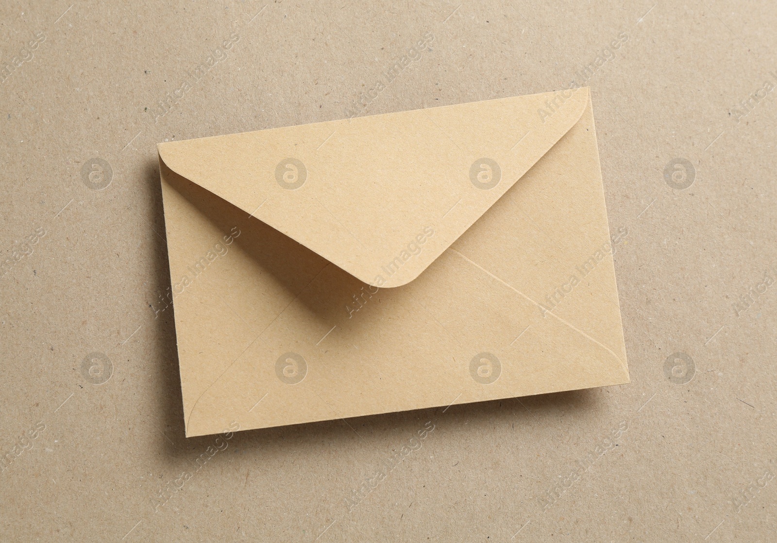 Beautiful invitation envelope on carton, top view Photo of Beautiful invitation envelope on carton, top view