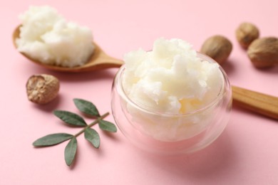 Photo of Natural shea butter on pink background, closeup