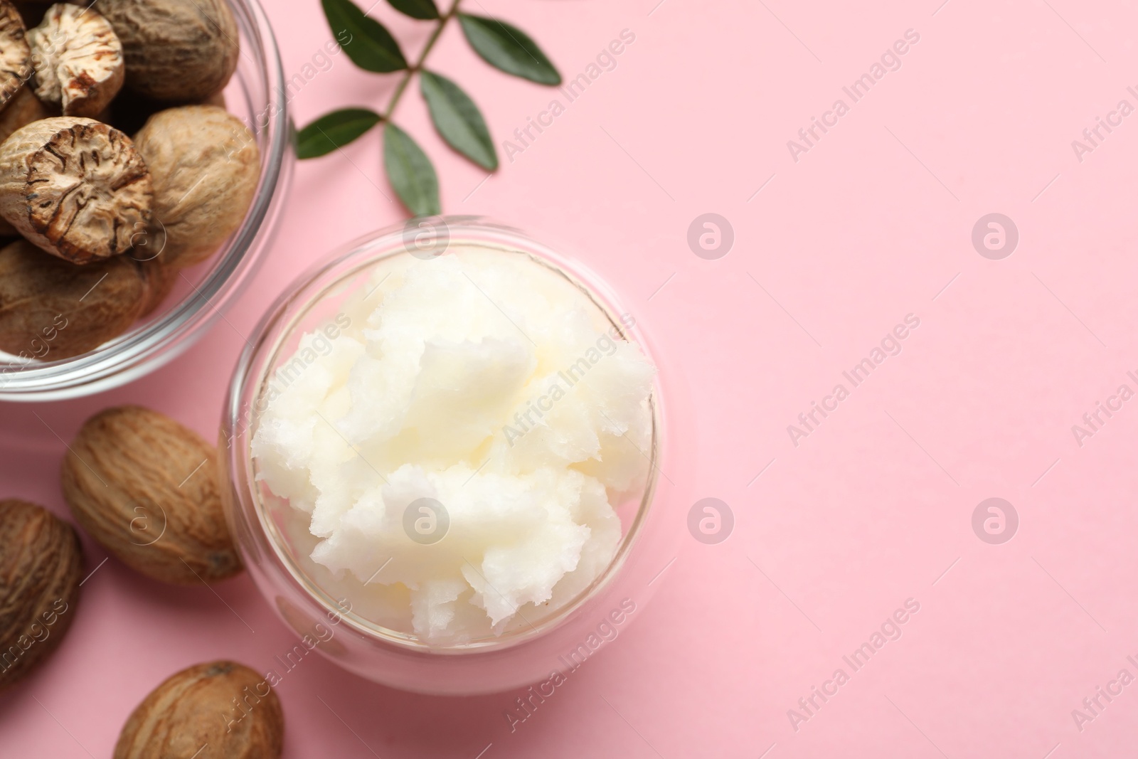 Natural shea butter on pink background, flat lay. Space for text Photo of Natural shea butter on pink background, flat lay. Space for text