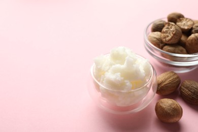 Photo of Natural shea butter on pink background, closeup. Space for text