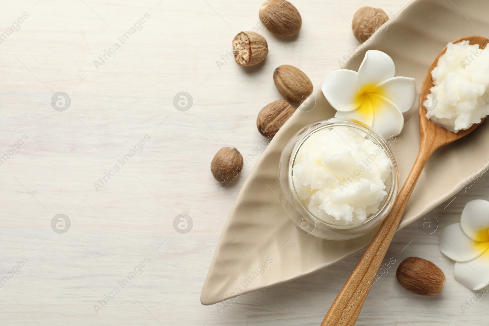 Natural shea butter on white wooden table, flat lay. Space for text Photo of Natural shea butter on white wooden table, flat lay. Space for text