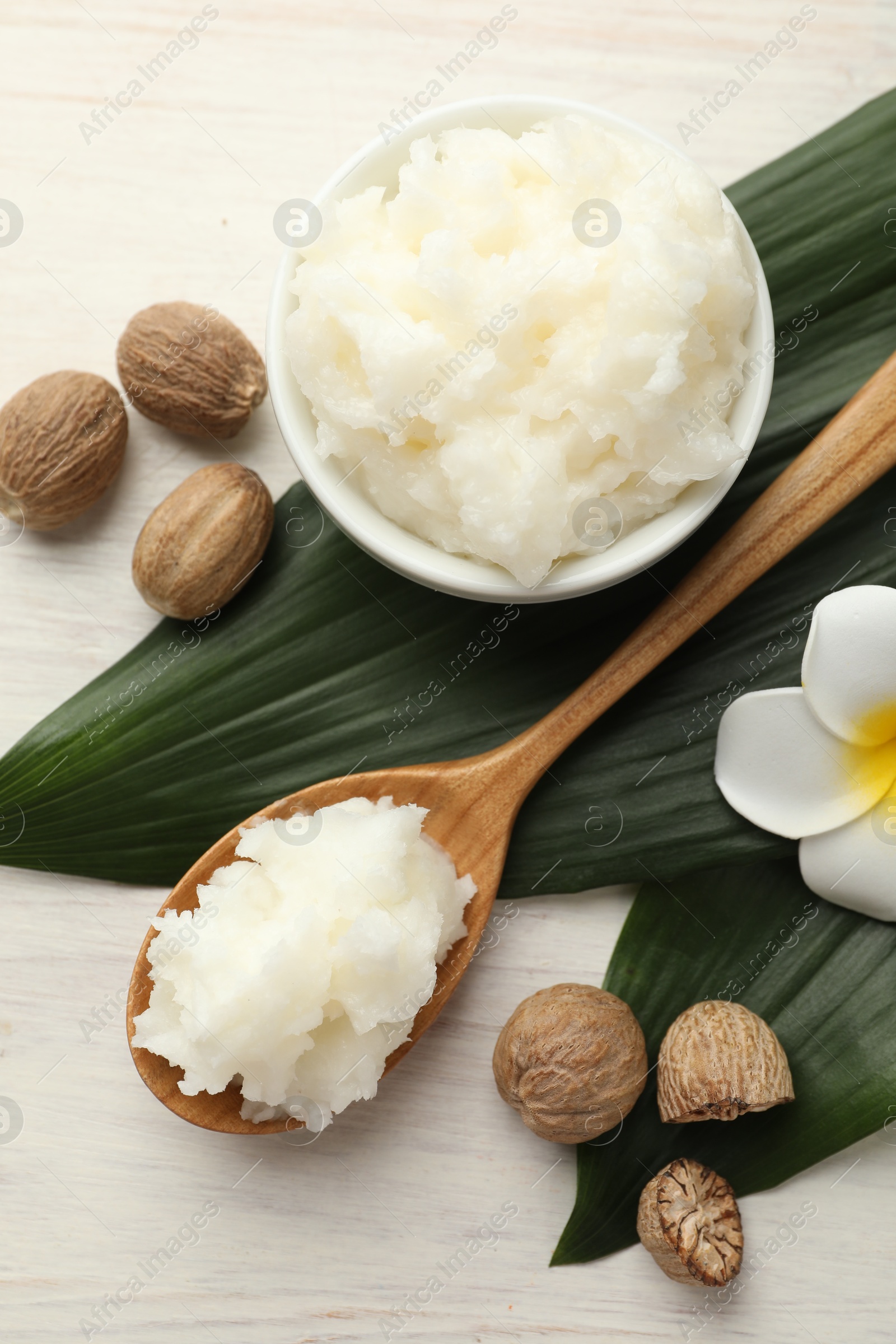 Natural shea butter on white wooden table, flat lay Photo of Natural shea butter on white wooden table, flat lay