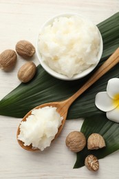 Photo of Natural shea butter on white wooden table, flat lay