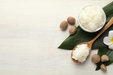 Photo of Natural shea butter on white wooden table, flat lay. Space for text