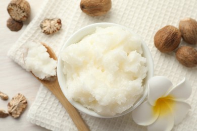 Photo of Natural shea butter on white table, flat lay