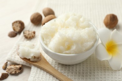 Photo of Natural shea butter on white table, closeup