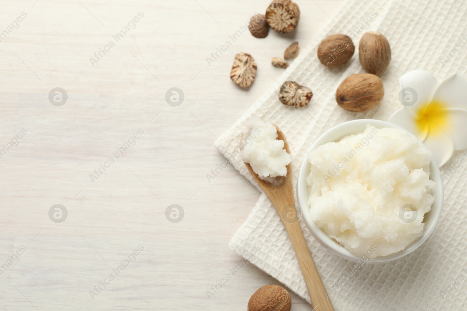 Natural shea butter on white wooden table, flat lay. Space for text Photo of Natural shea butter on white wooden table, flat lay. Space for text