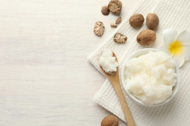 Photo of Natural shea butter on white wooden table, flat lay. Space for text