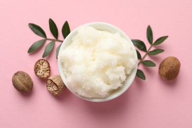 Photo of Natural shea butter on pink background, flat lay