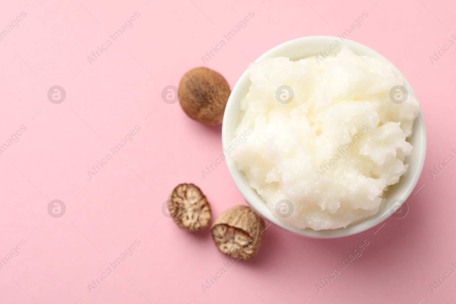 Natural shea butter on pink background, flat lay. Space for text Photo of Natural shea butter on pink background, flat lay. Space for text