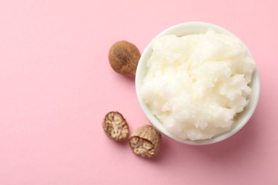 Photo of Natural shea butter on pink background, flat lay. Space for text