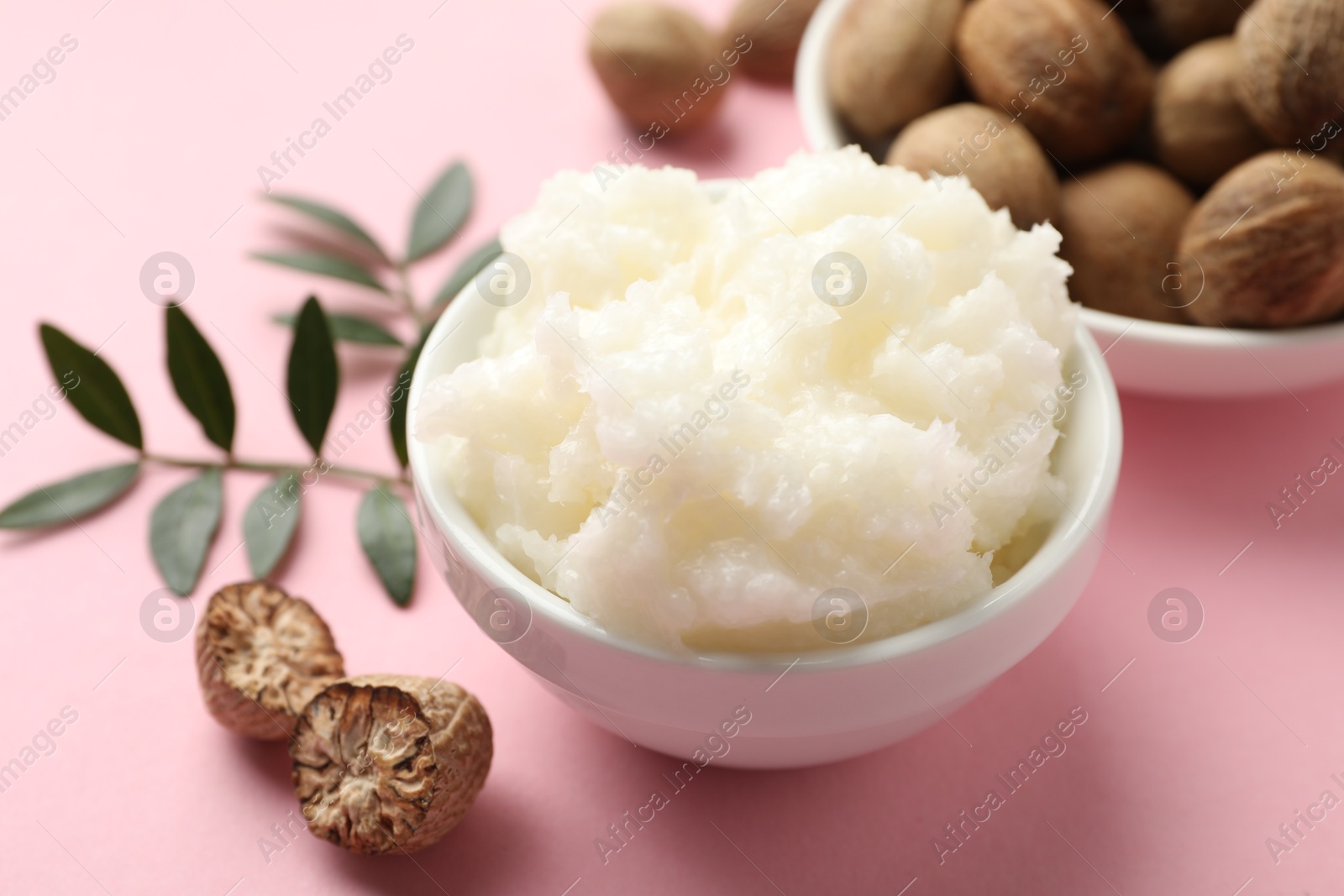 Natural shea butter on pink background, closeup Photo of Natural shea butter on pink background, closeup