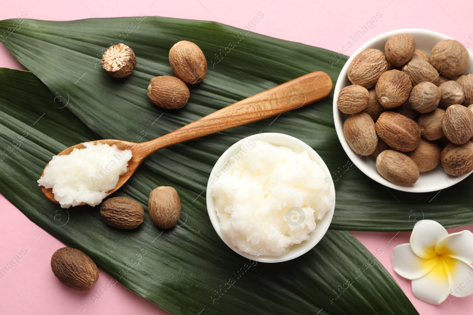 Natural shea butter on pink background, flat lay Photo of Natural shea butter on pink background, flat lay
