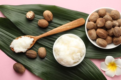Photo of Natural shea butter on pink background, flat lay