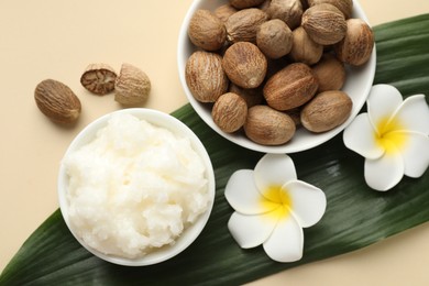 Photo of Natural shea butter on beige background, flat lay