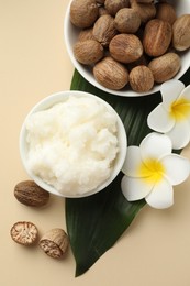 Photo of Natural shea butter on beige background, flat lay