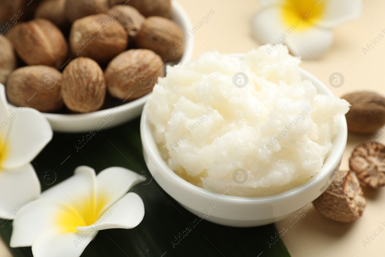 Natural shea butter on beige background, closeup Photo of Natural shea butter on beige background, closeup