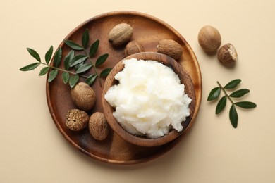 Photo of Natural shea butter on beige background, top view