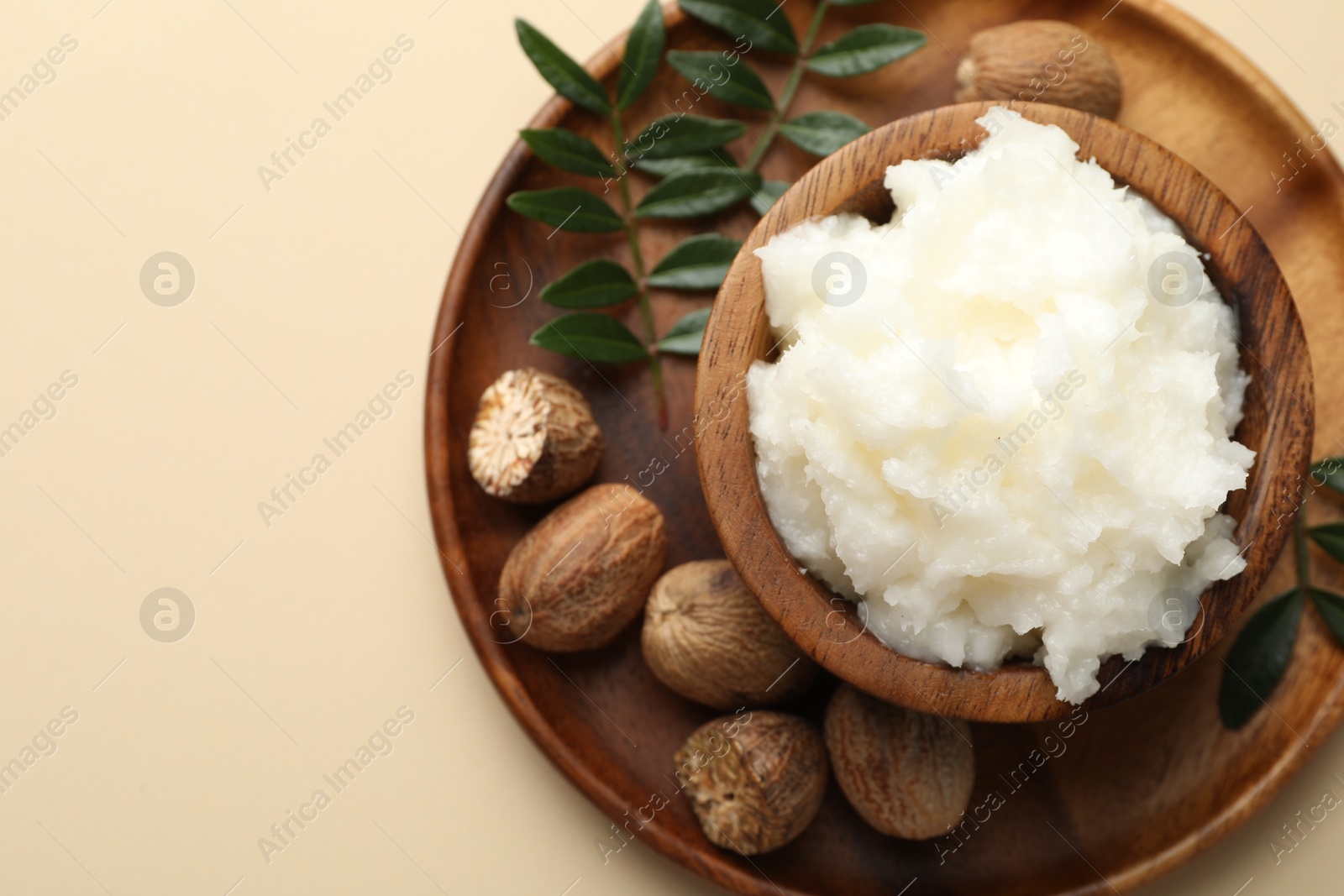 Natural shea butter on beige background, top view. Space for text Photo of Natural shea butter on beige background, top view. Space for text