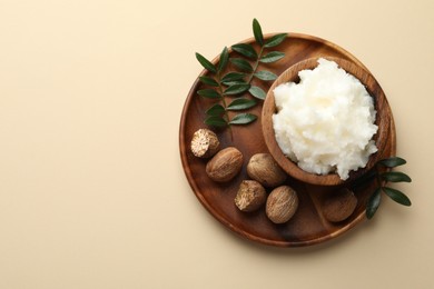 Photo of Natural shea butter on beige background, top view. Space for text
