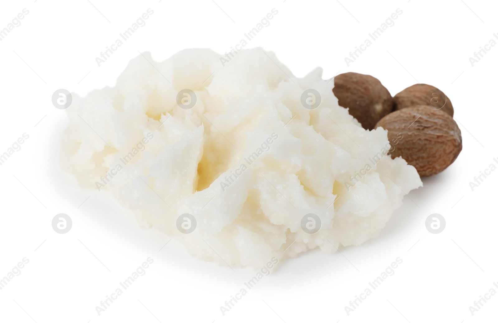 Shea butter and nuts isolated on white Photo of Shea butter and nuts isolated on white