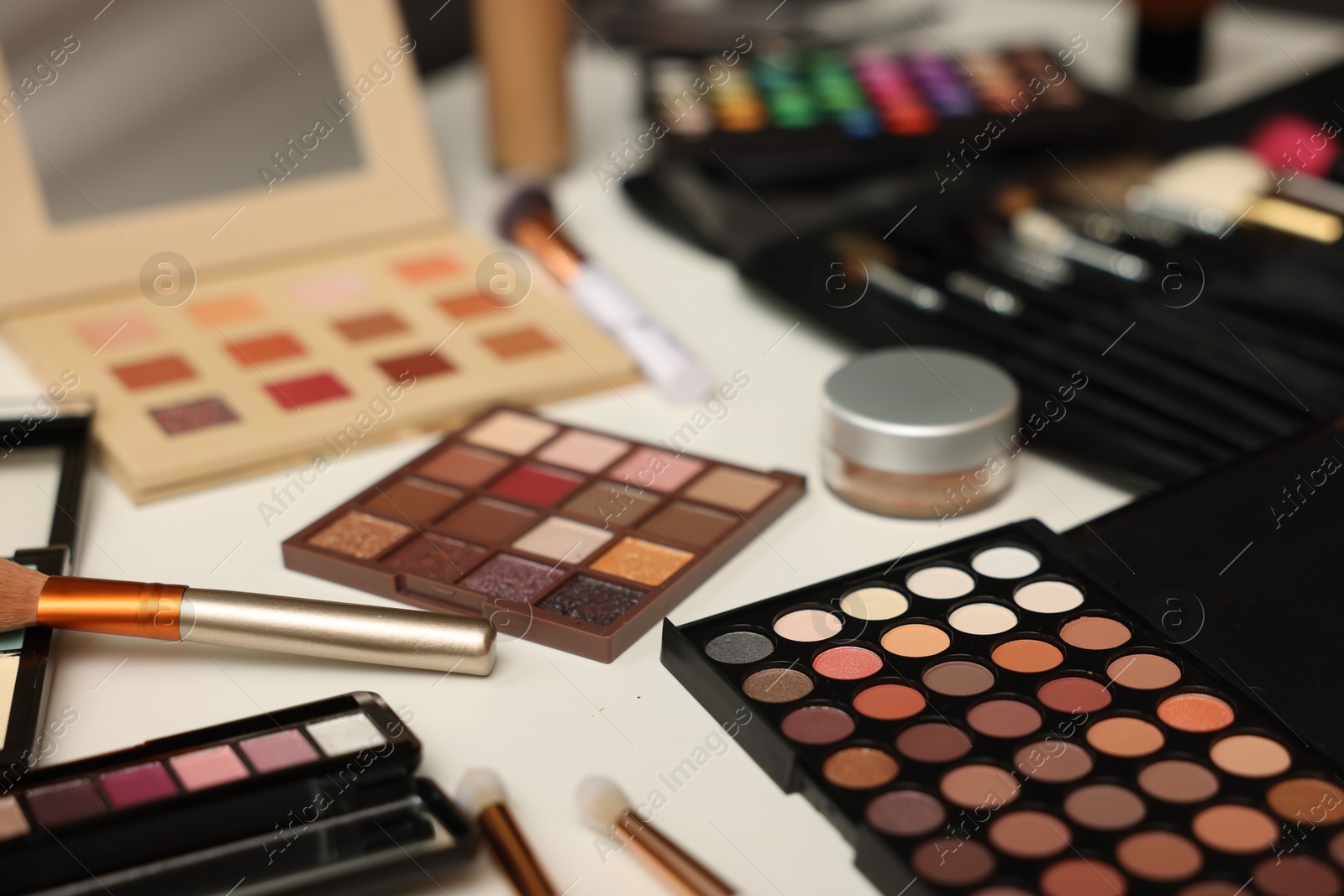 Different makeup products on dressing table, closeup Photo of Different makeup products on dressing table, closeup