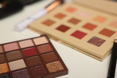 Photo of Different makeup products on dressing table, closeup