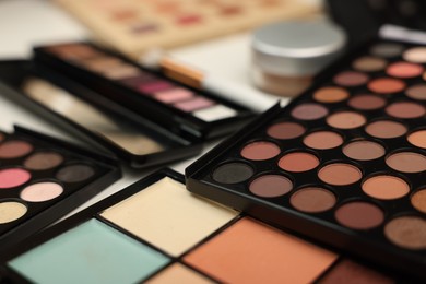 Photo of Different makeup products on dressing table indoors, closeup