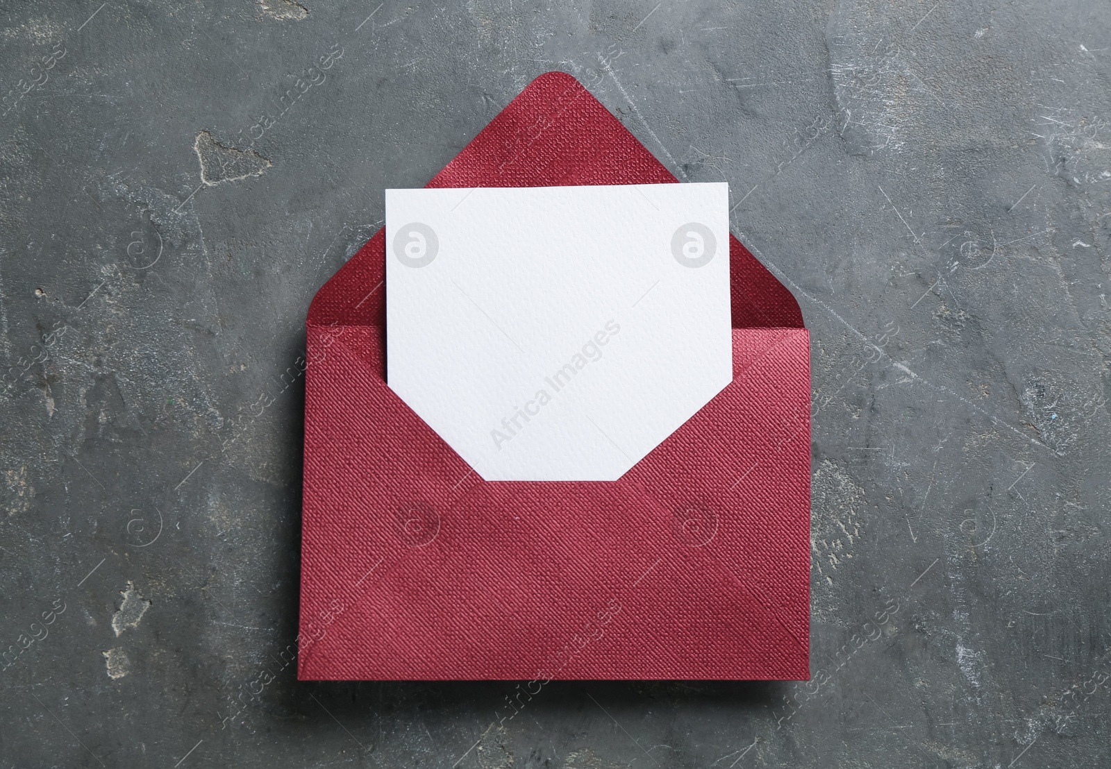 Blank invitation card and envelope on grey table, top view. Space for design Photo of Blank invitation card and envelope on grey table, top view. Space for design