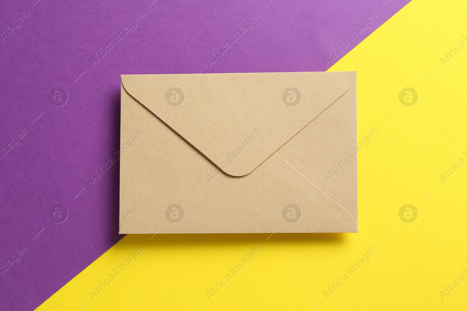 Beautiful invitation envelope on color background, top view Photo of Beautiful invitation envelope on color background, top view