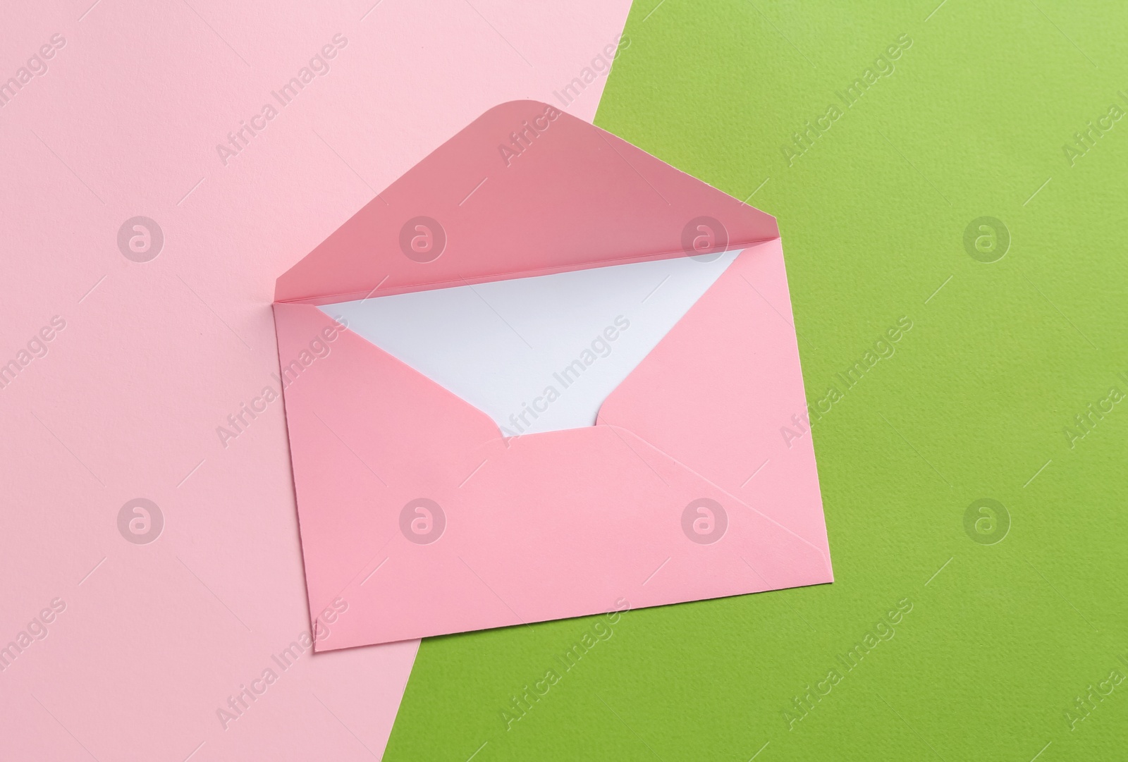 Blank invitation card and envelope on color background, top view Photo of Blank invitation card and envelope on color background, top view