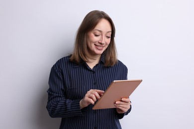 Photo of Woman with modern tablet on white background