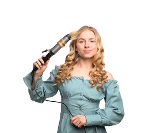 Photo of Woman curling her hair on white background